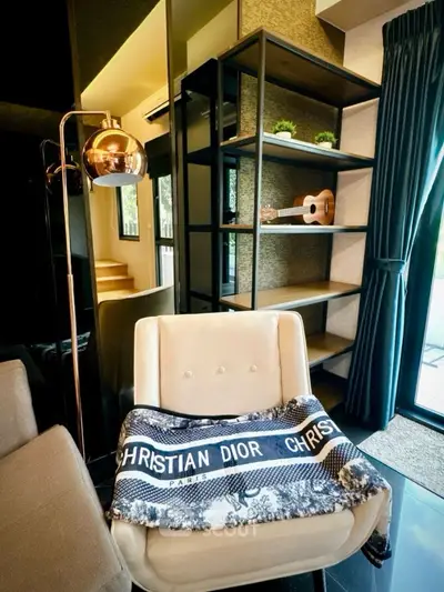 Stylish living room with modern decor and elegant shelving, perfect for urban living.