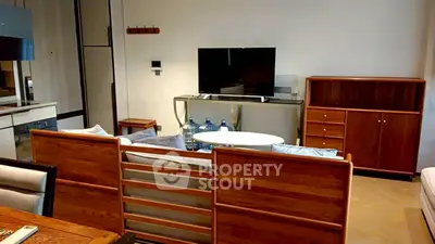 Modern living room with stylish wooden furniture and flat-screen TV