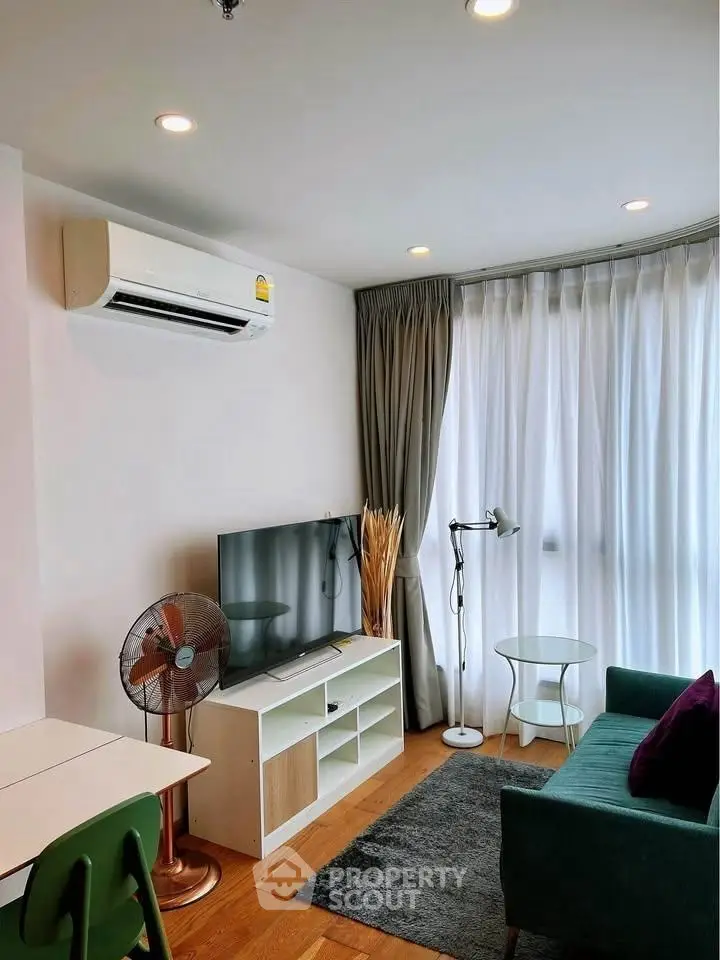 Modern living room with air conditioning and stylish decor