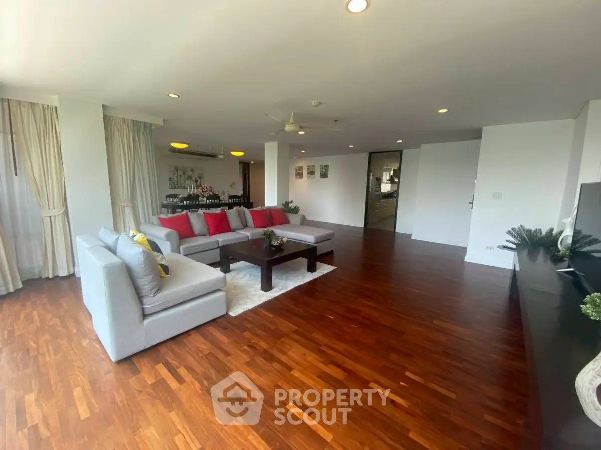 Spacious modern living room with hardwood floors and elegant decor