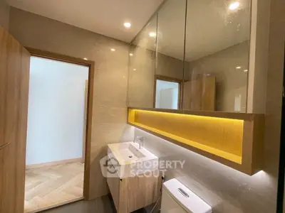 Modern bathroom with sleek vanity and ambient lighting