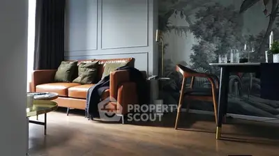 Stylish living room with leather sofa and artistic wall mural