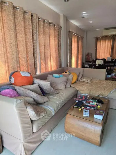 Spacious living room with cozy sectional sofa and natural light