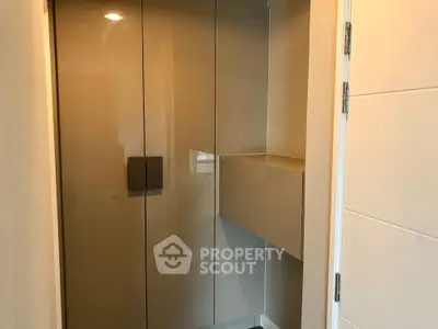 Modern storage area with sleek cabinetry and neutral tones