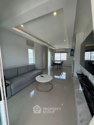 Modern living room with sleek design and ample natural light