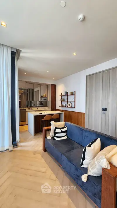 Modern open-plan living room with stylish kitchen and elegant decor