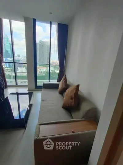 Modern living room with city view and cozy sofa