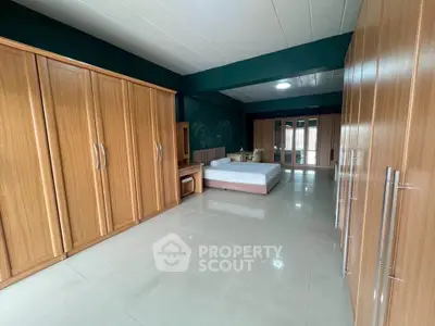 Spacious bedroom with ample wardrobe space and modern design