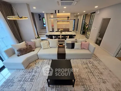 Luxurious modern living room with stylish decor and open layout, perfect for entertaining.
