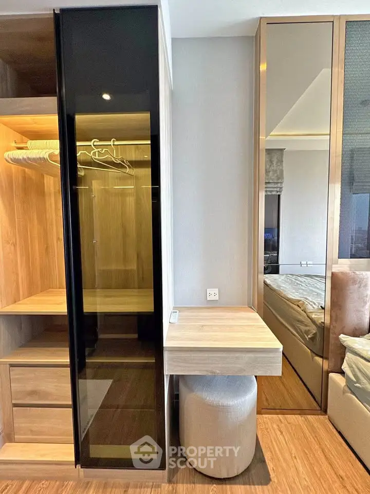 Modern bedroom with stylish wooden wardrobe and vanity area