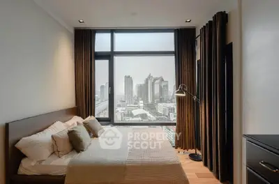 Luxurious bedroom with stunning city view and modern decor