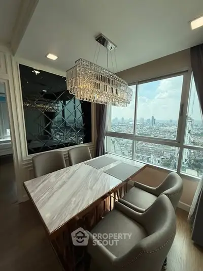 Luxurious dining area with stunning city view and elegant chandelier