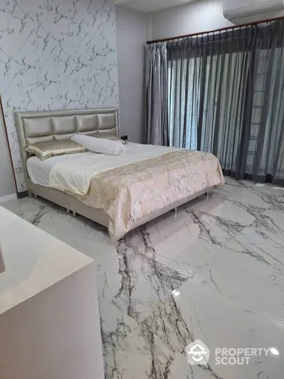 Luxurious bedroom with marble flooring and elegant decor