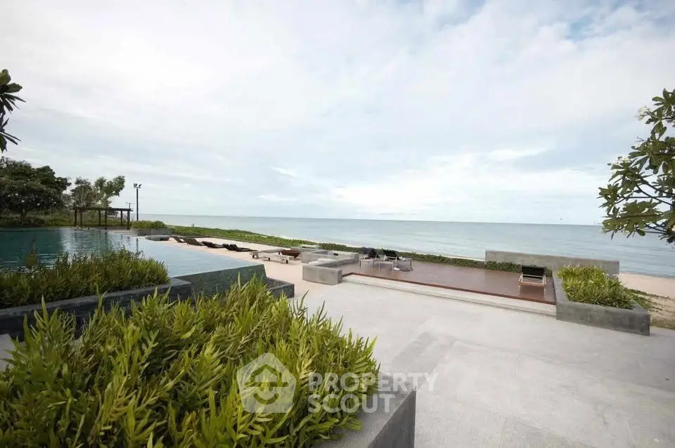 Luxurious beachfront property with stunning ocean view and infinity pool, perfect for relaxation and leisure.