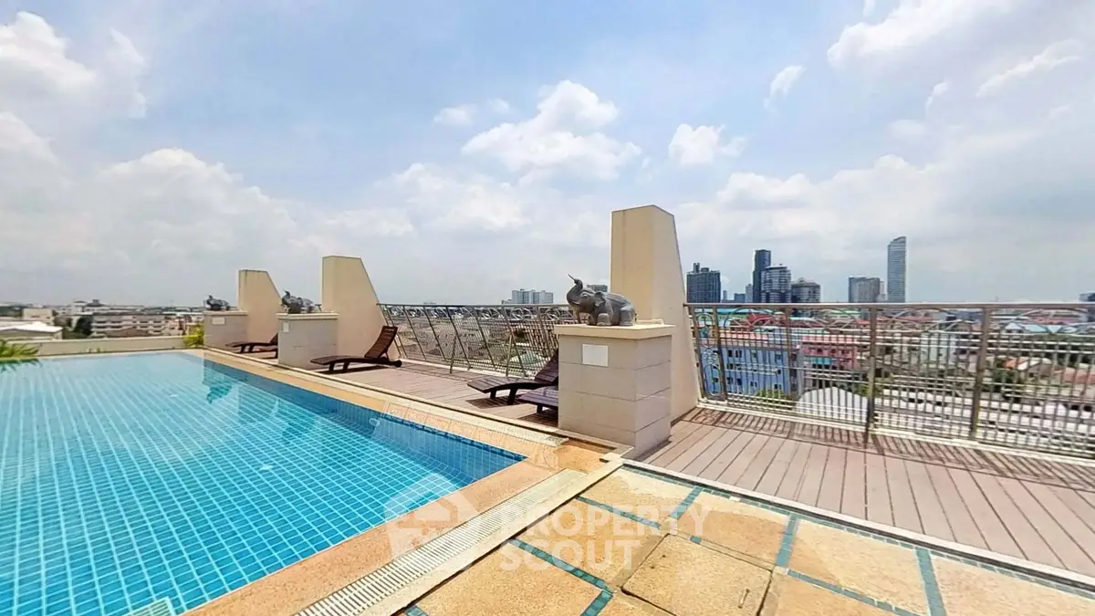 Stunning rooftop pool with city skyline views and lounging area