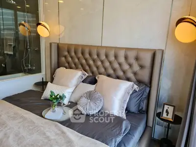 Luxurious bedroom with elegant tufted headboard and modern lighting