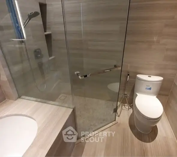 Modern bathroom with glass shower and sleek fixtures