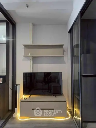 Modern living room with sleek TV unit and ambient lighting