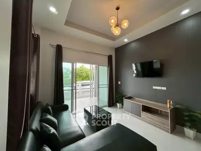 Modern living room with sleek furniture and balcony access