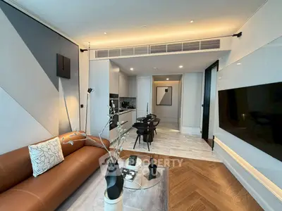 Modern living room with stylish decor and open kitchen layout