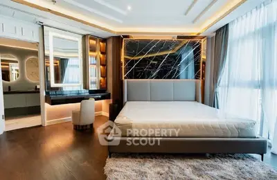 Luxurious modern bedroom with elegant decor and large windows