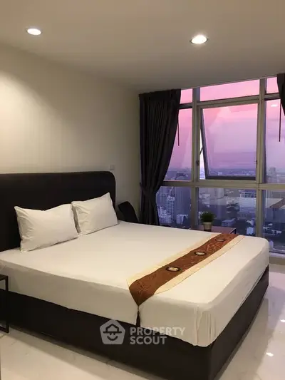 Luxurious bedroom with city view and elegant decor