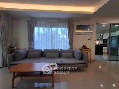 Modern living room with sleek furniture and ambient lighting