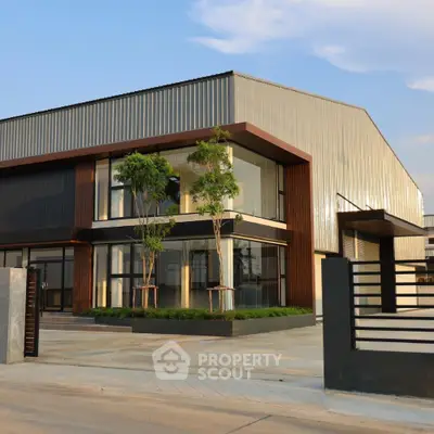 Modern industrial-style building with sleek design and large windows