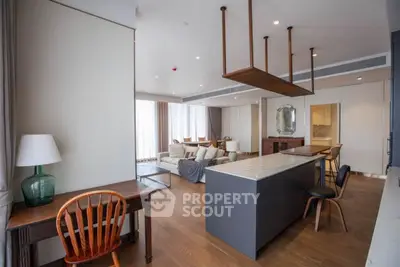 Spacious modern living room with open kitchen and elegant decor