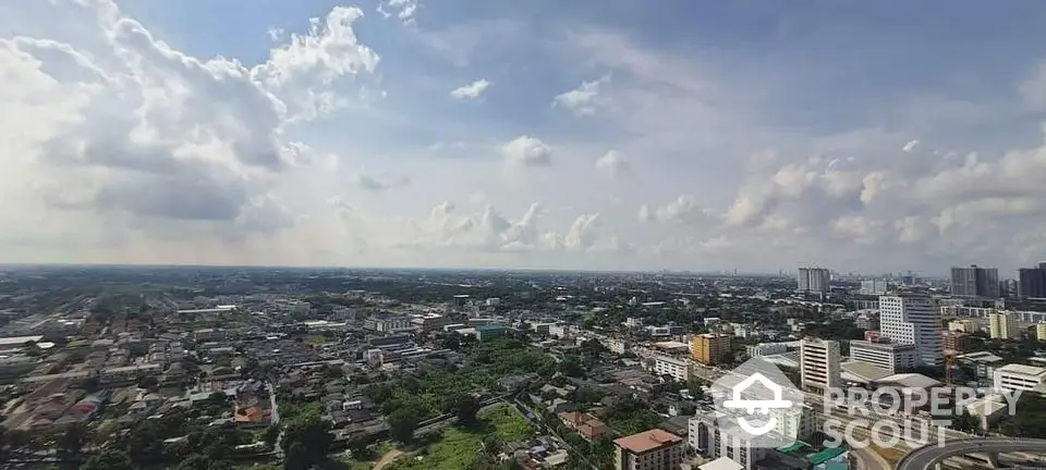 Stunning panoramic cityscape view from high-rise building showcasing urban skyline and expansive horizon.