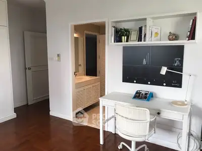 Chic study area with modern desk and shelving in a stylish home interior.