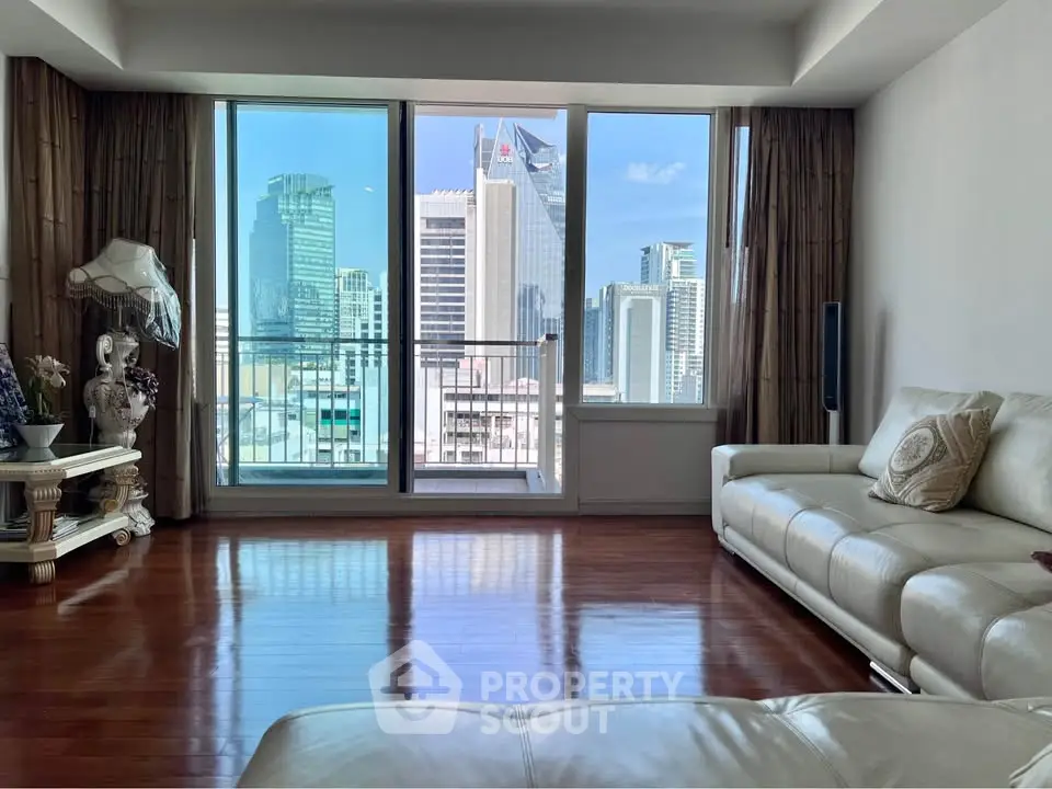 Spacious living room with stunning city view and elegant decor