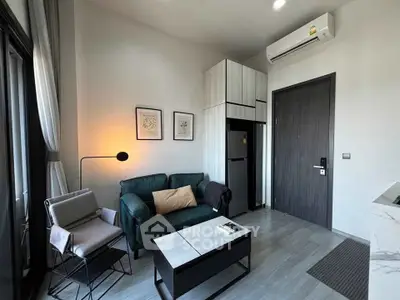 Modern living room with stylish furniture and air conditioning in a cozy apartment.