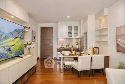 Modern living room with open kitchen, elegant dining area, and stylish decor
