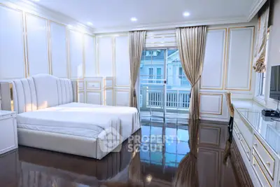 Luxurious bedroom with elegant decor and balcony view