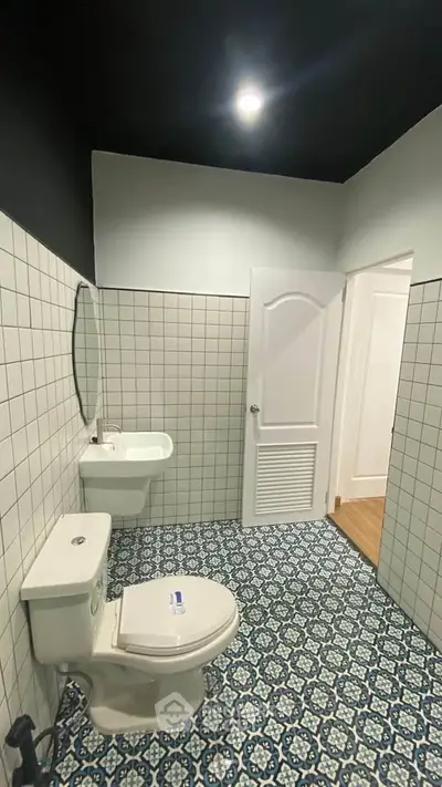 Modern bathroom with stylish tile flooring and sleek fixtures