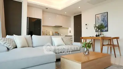 Modern living room with open kitchen and stylish furniture
