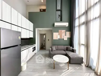 Modern living room with high ceilings, large windows, and sleek kitchen design