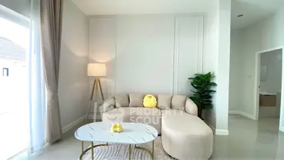 Modern living room with elegant beige sofa and stylish decor