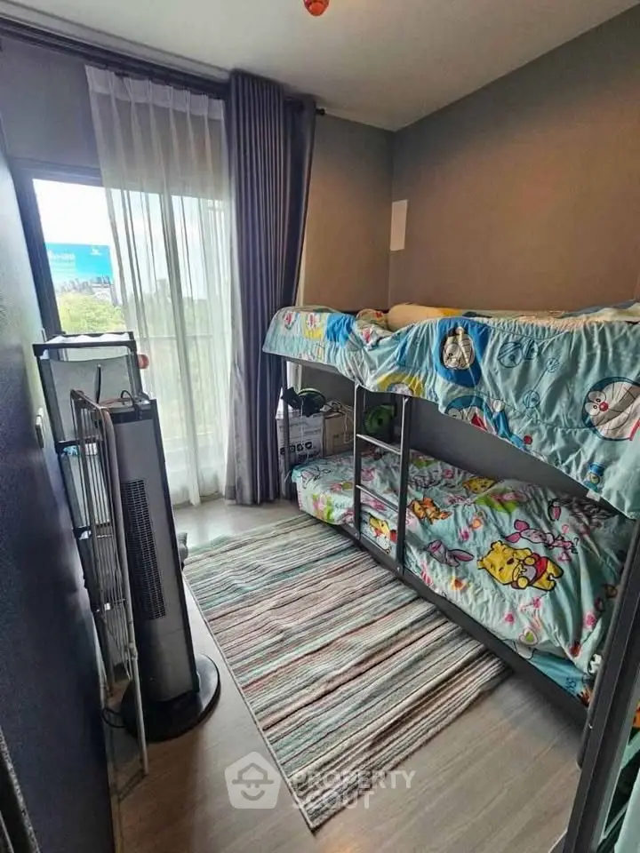 Charming children's bedroom with bunk beds and a cozy atmosphere.