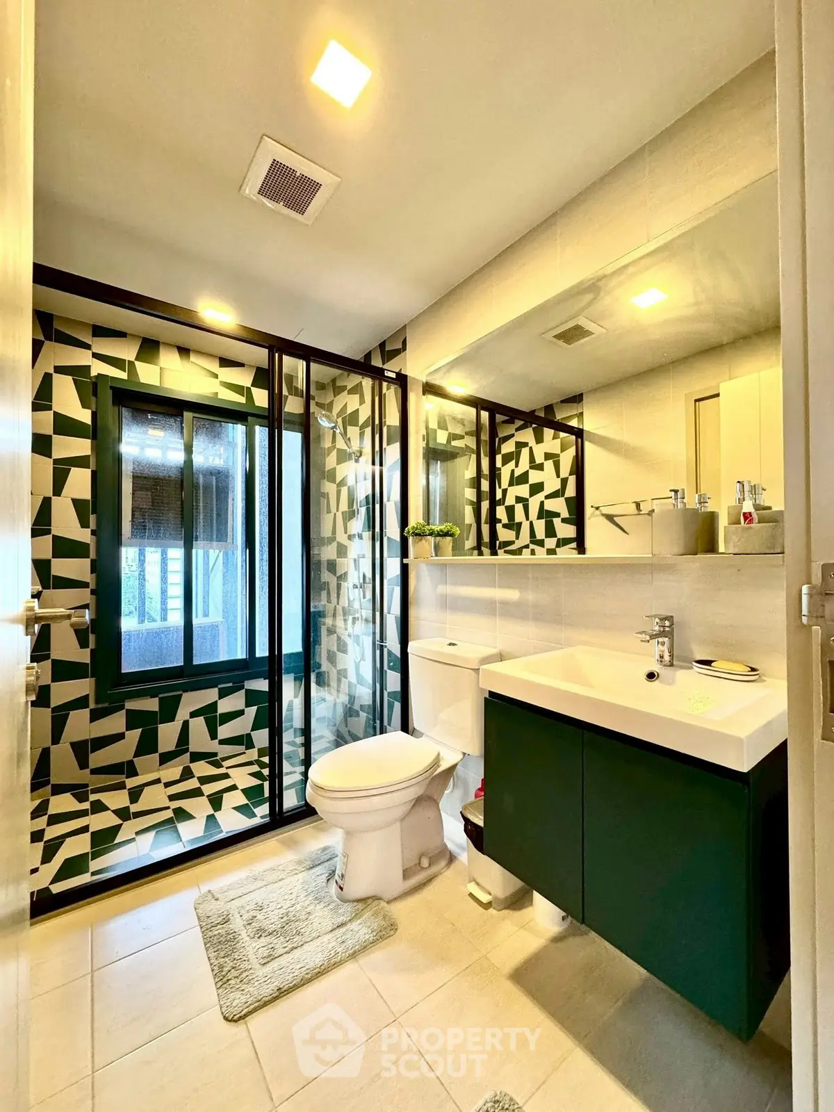 Modern bathroom with geometric tile design and sleek fixtures