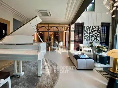 Luxurious living room with grand piano and elegant decor, featuring large windows and stylish furnishings.