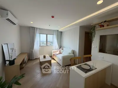 Modern living room with cozy decor and natural light, featuring a stylish open layout and scenic window view.