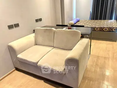 Cozy living area with plush sofa and modern decor in a stylish apartment.