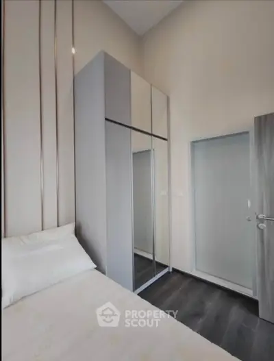 Modern bedroom with sleek wardrobe and minimalist design