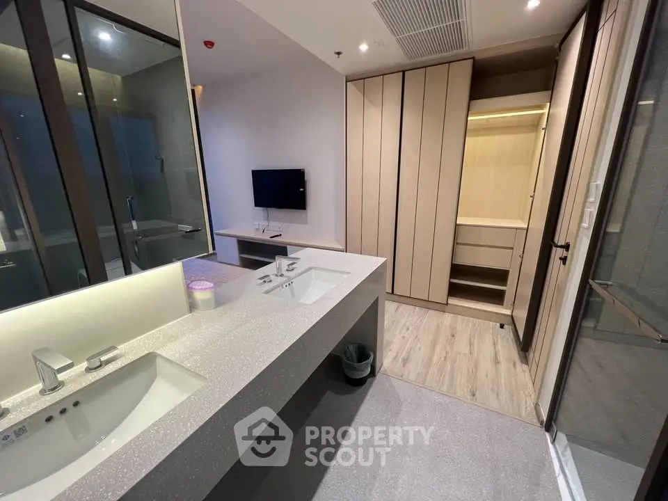 Modern bathroom with dual sinks and sleek cabinetry