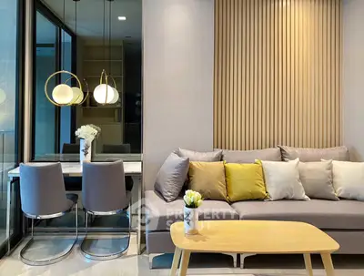 Modern living room with stylish decor and dining area