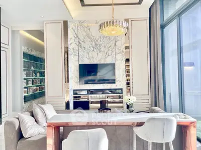 Luxurious living room with marble accents and elegant chandelier in modern apartment