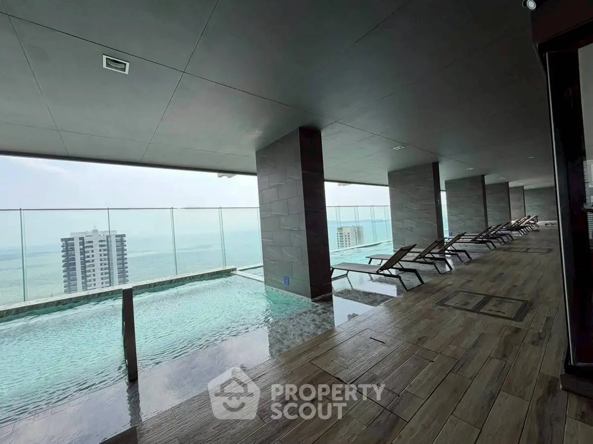 Luxurious rooftop pool with stunning ocean view and modern design, perfect for relaxation and leisure.
