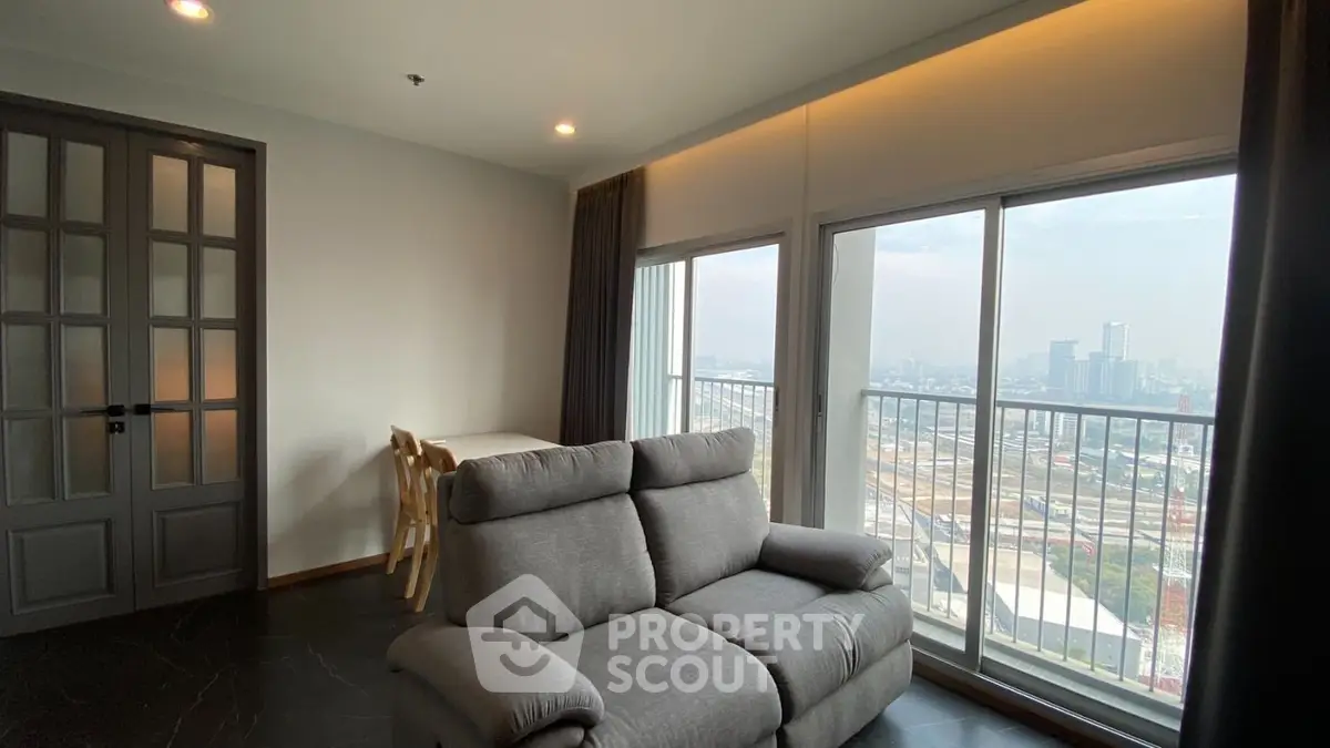Modern living room with city view and cozy seating area